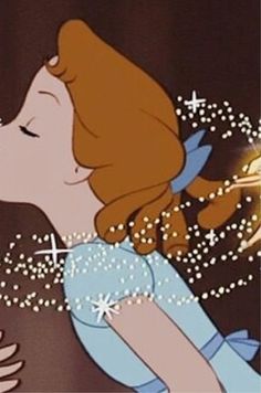 an animated image of a woman kissing a man's face with stars in the background