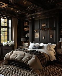 a large bed sitting in a bedroom next to a window filled with lots of books