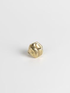 a gold ring on a white background