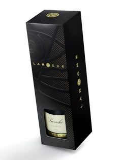 a bottle of wine in a black box with gold lettering on the front and side