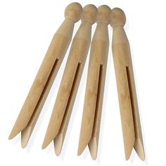 six wooden pegs are lined up in a row