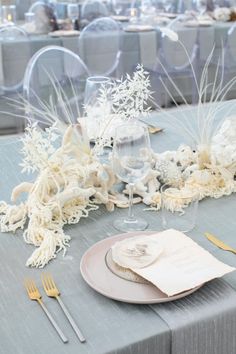 the table is set with silverware and place settings for an elegant dinner party or special event