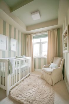 a baby's room with striped walls and white furniture