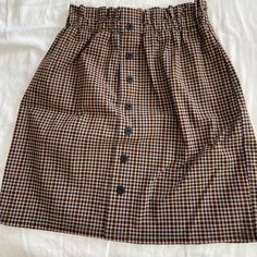 Checkered Skirt Perfect For Fall, Never Worn! Brown Cotton Skirt For Day Out, Cotton Brown Skirt For Day Out, Brown Mini Skirt With Button Closure, Brown Skirt With Button Closure, Retro Brown Skirt With Pockets, Casual Brown Mini Skirt For Day Out, Brown Relaxed Fit Skirt For Day Out, Relaxed Brown Skirt For Day Out, Brown Skirted Bottoms For Fall