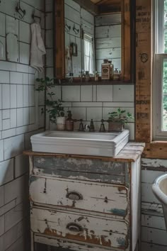 an old dresser with a sink and mirror in a bathroom