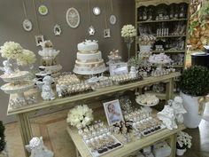 a table filled with lots of different types of cakes and cupcakes on top of it