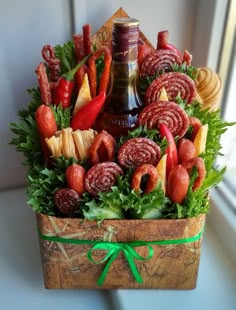 a wooden box filled with lots of different types of meats and veggies