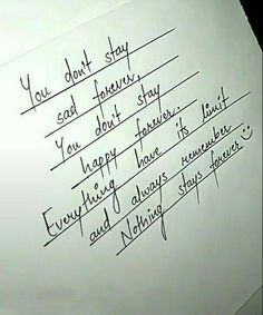 a handwritten note on a white piece of paper with writing in cursive font