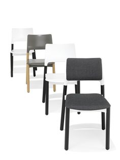 four different colored chairs with black legs and white, gray, and grey seat covers