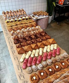 many different types of pastries are on display