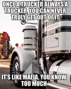 a white semi truck driving down a street next to a road with the words, once a trucker always a trucker you can never truly get out of it