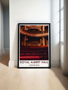 the royal albert hall london poster is displayed in an empty room