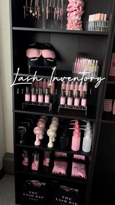 a shelf filled with lots of pink and black items