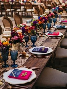 a long table with plates and place settings