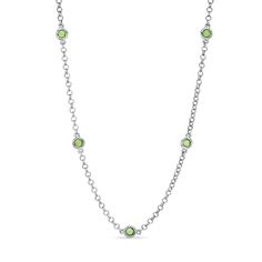 A high-impact look with shimmer to spare, this stunning necklace pairs sterling silver rolo-link chain with dazzling peridot gemstones in a look that grabs the eye. Five gorgeous 3.0mm round peridots are carefully bezel set along the chain, creating the illusion that they are floating in midair. Polished to a brilliant shine, this 18.0-inch necklace makes a thoughtful gift for the August birthday girl. The style secures with a lobster claw clasp. August Birthday, Peridot Stone, Peridot Gemstone, Station Necklace, Stunning Necklace, Birthday Girl, White Metal, Stone Settings, Necklace Designs