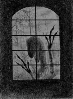 a black and white photo of a dog looking out a window at the woods outside