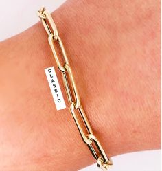 The Most Versatile & Fashionable Gold Bracelet You Will Ever Wear. Perfect On Its Own, As A Compliment To Other Gold or Diamond Bracelets Or Accented With Charms. Compare Our Link Size and Gold Weight To Anyone: Based on 7" Length La Petite 3.7mm wide x 12mm long (1/8" x 5/8") 2.6 Grams. Classic 5.3mm wide x 16mm long (1/4" x 1/2") 3.1 Grams. Grande 5.8mm wide x 21mm long (5/16" x 3/4") 4.5 Grams. OMG 9.0mm wide x 22mm long (3/8" x 7/8") 7..5 Grams AVAILABLE IN 14KT YELLOW & WHITE GOLD AVAILABLE IN VARIOUS SIZES IN STANDARD & CUSTOM LENGTHS. Contact Us For Custom Lengths and Pricing. UNIQUE LOBSTER CLASP ALLOWS YOU TO CUSTOMIZE THE LENGTH TO FIT THE DAYS WARDROBE. THE MATCHING NECKLACE MAKES A PERFECT COMBINATION 🔹FREE PRIORITY SHIPPING 🛩 Ready to Ship In 3 to 5 Days. RUSH ORDERS AVAILAB Classic Bangle Jewelry With Gold Clasp, Classic Bangle With Gold Clasp, Classic Gold-tone Jewelry With Bracelet Strap, Classic Jewelry With Gold Clasp And Rectangular Links, Classic Jewelry With Rectangular Links And Gold Clasp, Classic Jewelry With Gold Clasp Oval Link, Classic Gold Plated Bracelet With Strap, Classic Jewelry With Gold Clasp For Gift, Classic Formal Paperclip Bracelet With Polished Finish