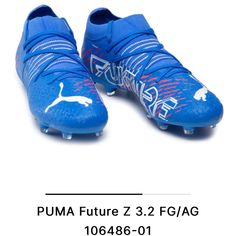 a pair of blue soccer shoes with white lettering on the bottom and bottom, which reads puma future z 3 2 fgag ag