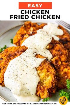 chicken fried with gravy and ranch sauce on a white plate next to a fork