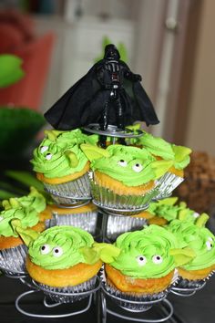 star wars cupcakes with green frosting and darth vader figurines