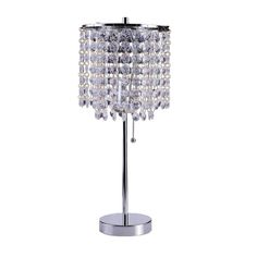 a crystal table lamp on a metal base