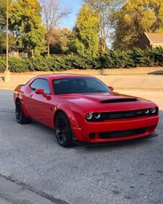 a red sports car parked in a parking lot