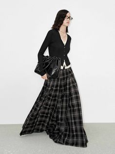 MO&Co. Women's Flowy Plaid Maxi Skirt This skirt is made from a premium wool blend, providing warmth and comfort. Features flowing maxi silhouette and pleated design to create a classic, elegant look. With a side pocket and zip closure, it offers convenience and style. Perfect pair it with a knit top for the ultimate seasonal ensemble. Features : - Flowy maxi silhouette- Layered detail and side pocket- Pleated design, plaid pattern- Made from premium wool blend Code: MBD4SKT028The back length of Maxi Skirt Pleated, Long Skirt Plaid, Maxi Plaid Skirt Outfit, Maxi Pleated Skirt Outfit, Long Plaid Skirt Outfit, Layered Maxi Skirt, Plaid Maxi Skirt, Long Plaid Skirt, Flannel Skirt