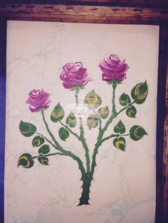 a painting with purple roses on it in a wooden frame