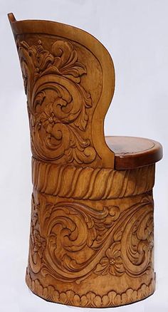 a wooden chair with carved designs on it