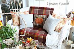 a white chair with fall decorations on it