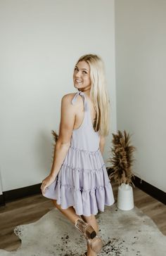 Step into carefree vibes with the Sundown Serenade Tiered Babydoll Dress. Made from textured crepe fabric, this boho-inspired dress features tiered ruffles for a playful, flowy silhouette that dances with every step. The adjustable tie straps allow for a customizable fit, making it perfect for sunny beach days or warm nights out. With its wide bottom sweep, this dress adds an effortlessly feminine touch to any occasion. Whether you're strolling through a farmers' market or heading to a casual su Feminine Flowy Mini Dress With Tiered Skirt, Flowy Feminine Tiered Skirt Mini Dress, Pink Flowy Tiered Mini Dress, Tiered Babydoll Dress, Boutique Aesthetic, Beach-ready Mini Tiered Cotton Dress, Beach Mini Dress With Smocked Bodice And V-neck, Western Boutique, Sunny Beach