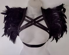 Black feather epaulette harness Carnival Mardi Gras Festival shoulder pads Wings Burning Man Cosplay LARP pauldrons These statement feather epaulettes are an outstanding, versatile, quality accessory perfect for festivals like Burning Man. This is a unisex design, custom made to order that compliments both the male and female form. This is a unique design, custom made from several layers of high quality black iridescent feathers and black feathers. Your feathers will be sewn robustly by machine to avoid any shedding of feathers. This design is then finished to a high standard with hand stitching and lined with care and attention to detail. I take pride in providing quality designs and satisfaction to my customers. Fastener options These epaulettes are stitched  to the harness which fasten Feather Pauldron, Festival Epaulettes, Shoulder Pads Fashion, Feather Costume Accessories For Carnival Cosplay, Feather Epaulette, Feather Burlesque, Iridescent Feathers, Mardi Gras Festival, Man Cosplay