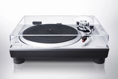 an old record player is shown with its turntable in the foreground, on a white background