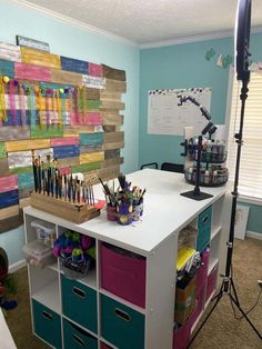 a room with many crafting supplies on the desk