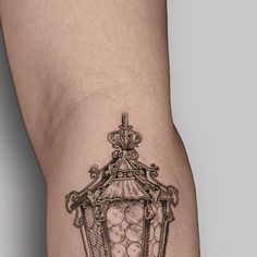 a close up of a person's leg with a tattoo design on the thigh