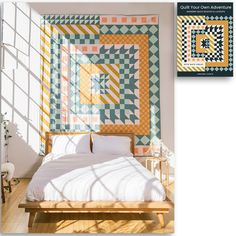 a bed sitting under a window next to a wall with a quilt hanging on it