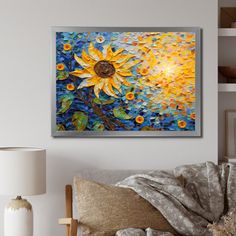 a living room with a couch, lamp and painting on the wall above it that has sunflowers painted on it