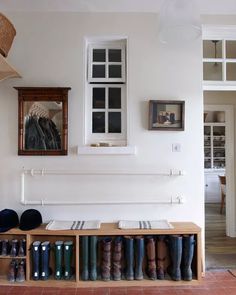 the entryway is clean and ready for guests to use it as a shoe storage area