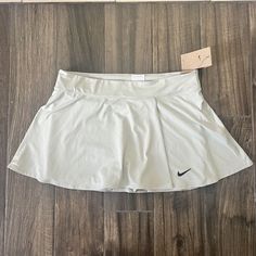 Nike Tennis Standard Fit Skirt Gray Ish Blue Size Xl Please Check Pictures For Any Measurements The Color Has A Hint Of Blue But Also Gray Nike Stretch Lined Skirt Bottoms, Nike Pleated Skort For Spring, Nike Casual Pleated Skirt, Nike Lined Skirt For Spring, Spring Swim Skirt With Pockets, Nike Short Lined Skirt, Nike Pleated Tennis Skirt For Spring, Nike Spring Pleated Skirt, Nike Mini Tennis Skirt For Spring