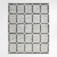 a black and white rug with squares on it