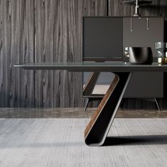 a modern desk with glass top in front of a wood paneled wall and floor