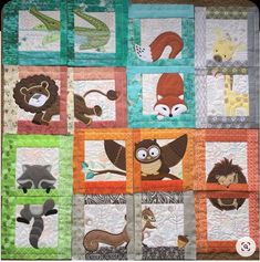 a quilted wall hanging with animals on it