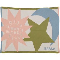 a colorful pillow with stars and crescents on the front, which reads 12 / 2 / 2013