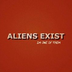 the words aliens existt i'm one of them written on a red wall