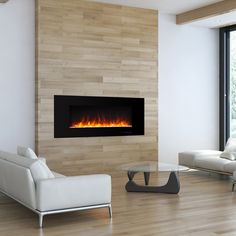 a living room with white furniture and a fire place in the fireplace that is glowing orange