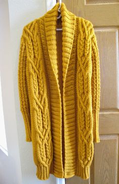 "Women's Jacket Handmade Knitted Gold Cardigan Shawl Collar Long Sleeve Open Front Long Coat. Made of soft acrylic yarn. Approximately measurements : shoulder to shoulder     18\" pit to pit     21\" armhole     9\" sleeve  -  shoulder to cuff     26\"              -  underarm to cuff     19\" cuff     4\" bottom     20\" length     37\" collar     11\" Machine washable.  Low iron.  Do not bleach. Do not tumble dry.  Dry clean.  Dry flat. *Note - Do the best to get photos of the actual color, bu Fall Wool Sweater Coat With Knit Fabrication, Wool Knit Sweater Coat For Fall, Merino Wool Cardigan For Fall, Cable Knit Merino Wool Long Sleeve Cardigan, Merino Wool Cable Knit Long Sleeve Cardigan, Knitted Merino Wool Cardigan For Fall, Fall Knitting Pattern For Cold Weather, Knit Knitting Pattern For Cold Weather, Long Wool Knitted Outerwear