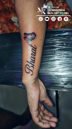 a person with a tattoo on their arm and the word columbus written in cursive writing