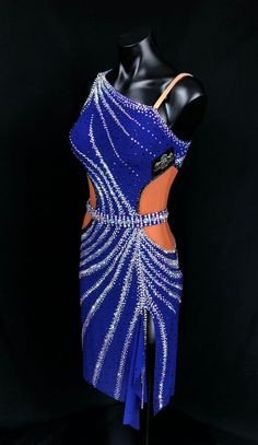 a mannequin is dressed in blue and silver with sequins on it