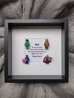 some legos are on display in a shadow box with a sign that says dad