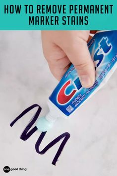 someone is using toothpaste to remove permanent marker stains